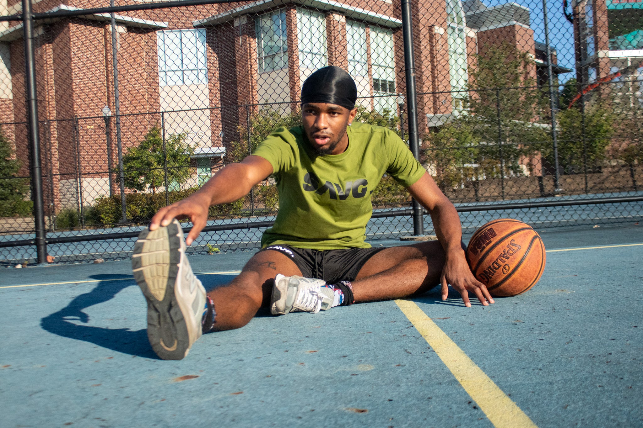 Basketball Gear. SAVG Green shirt and black shorts 6.5 inch inseam. Durable shorts and shirt for intense workout.
