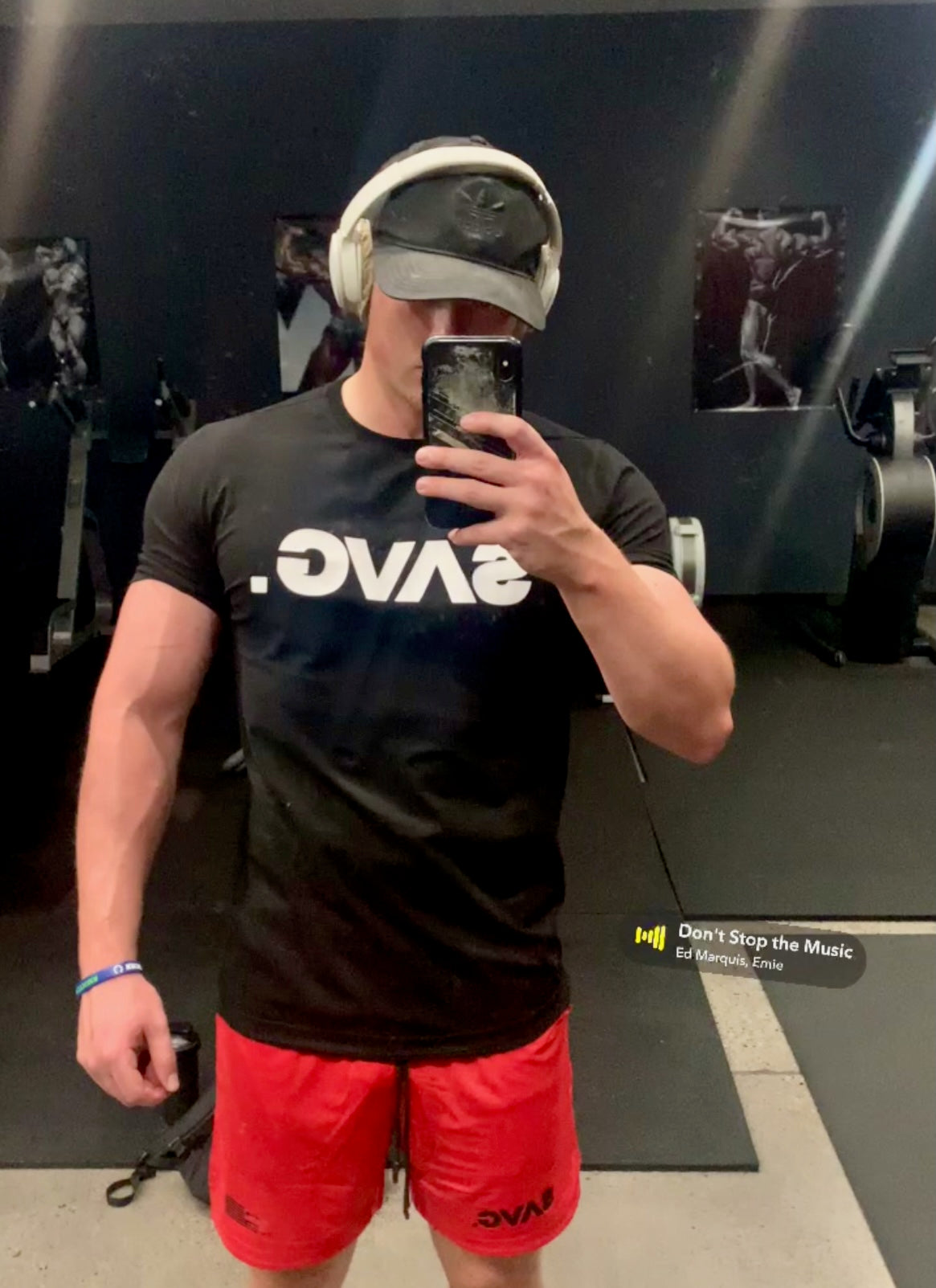 Strong guy wearing SAVg Tshirt and red shorts